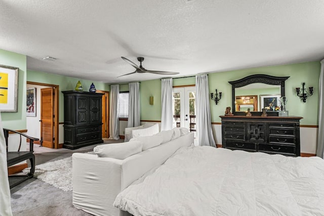 4 Santa Maria Ln, Saint Augustine, FL 32080 - carpeted bedroom with french doors, access to exterior, a textured ceiling, ceiling fan, and baseboards
