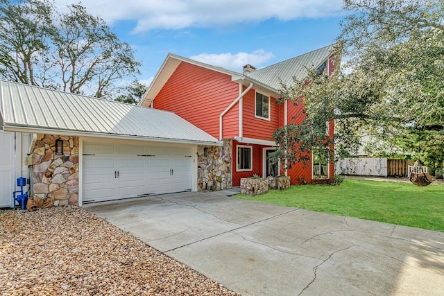 4 Santa Maria Ln, Saint Augustine, FL 32080 - view of front of property with stone siding, driveway, metal roof, and a chimney