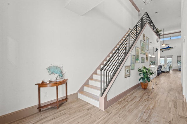 3 Menorca Way, Palm Coast, FL 32137 - staircase featuring wood finished floors and a towering ceiling