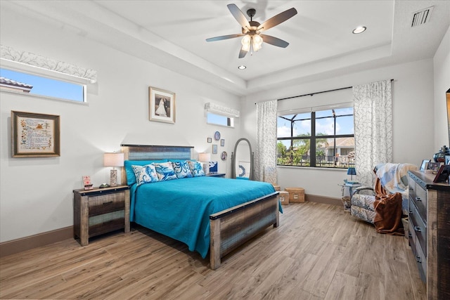 3 Menorca Way, Palm Coast, FL 32137 - bedroom featuring wood finished floors, multiple windows, a tray ceiling, and recessed lighting