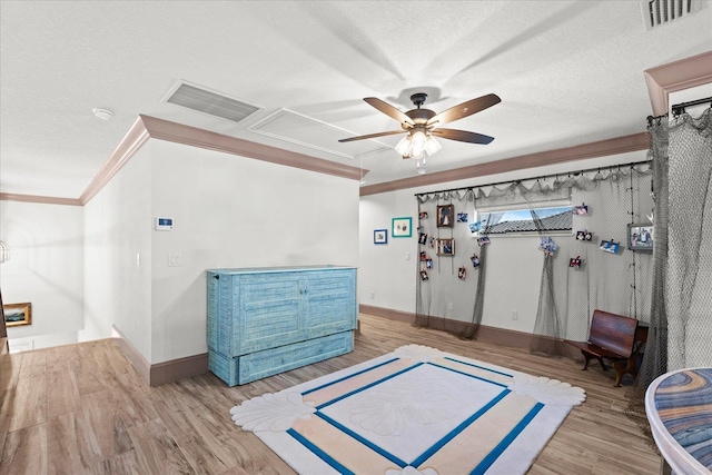 3 Menorca Way, Palm Coast, FL 32137 - interior space with wood finished floors, attic access, ornamental molding, ceiling fan, and a textured ceiling