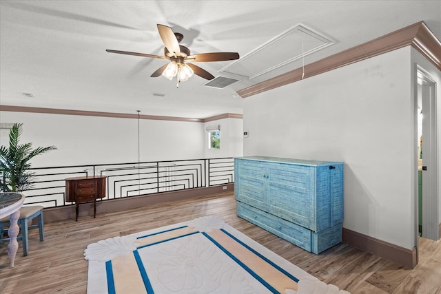 3 Menorca Way, Palm Coast, FL 32137 - sitting room featuring attic access, ceiling fan, crown molding, wood finished floors, and an upstairs landing