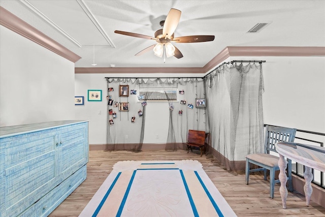 3 Menorca Way, Palm Coast, FL 32137 - living area with attic access, ceiling fan, light wood finished floors, and crown molding