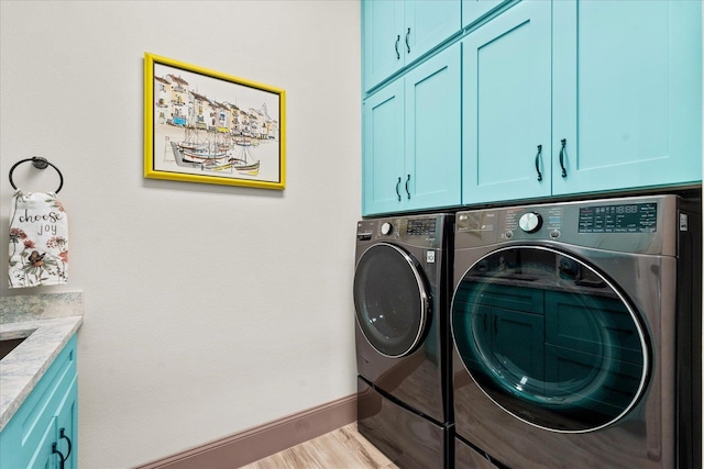3 Menorca Way, Palm Coast, FL 32137 - washroom featuring cabinet space, separate washer and dryer, and wood finished floors