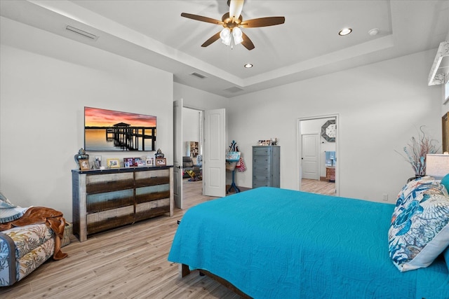 3 Menorca Way, Palm Coast, FL 32137 - bedroom featuring light wood finished floors, a raised ceiling, recessed lighting, and ceiling fan