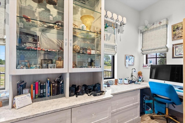 3 Menorca Way, Palm Coast, FL 32137 - bar area featuring light wood-type flooring and built in study area