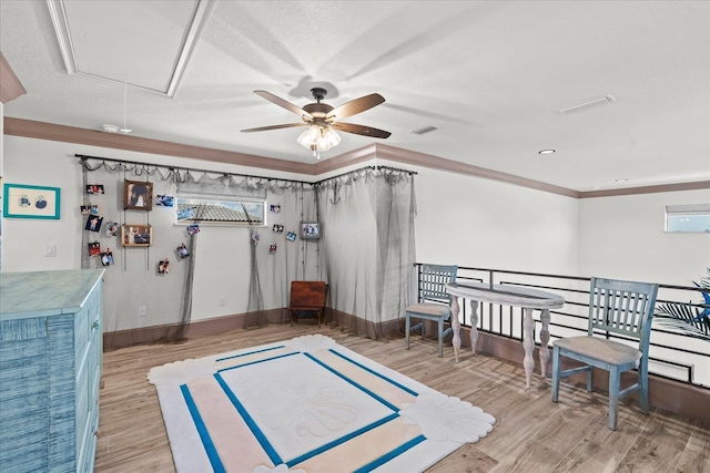 3 Menorca Way, Palm Coast, FL 32137 - interior space with attic access, wood finished floors, a ceiling fan, and crown molding