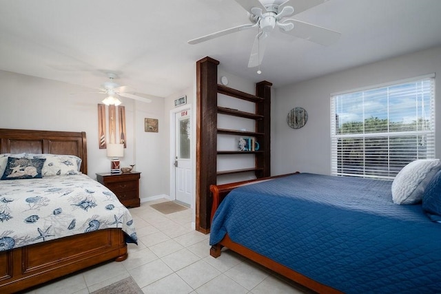 7012 S A1A, Saint Augustine, FL 32080 - bedroom featuring light tile patterned floors, ceiling fan, and baseboards