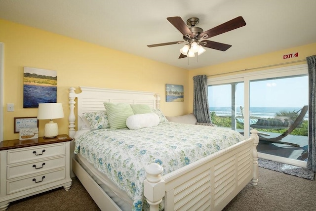 7012 S A1A, Saint Augustine, FL 32080 - bedroom with dark carpet, access to exterior, a ceiling fan, and a water view