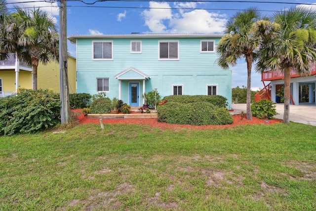 8961 A1A, Saint Augustine, FL 32080 - view of front of house featuring a front yard, driveway, and stucco siding