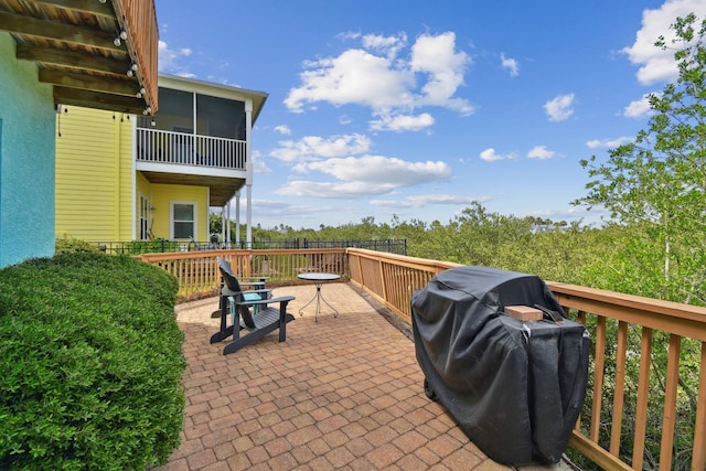 8961 A1A, Saint Augustine, FL 32080 - view of patio / terrace featuring a grill and a sunroom