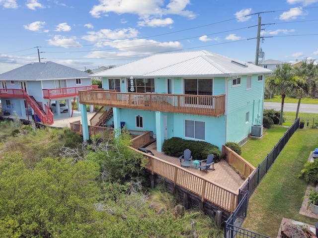 8961 A1A, Saint Augustine, FL 32080 - back of property featuring stairs, a fenced backyard, and a deck