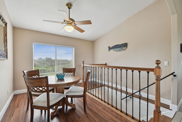8961 A1A, Saint Augustine, FL 32080 - dining room with wood finished floors, a ceiling fan, and a textured ceiling