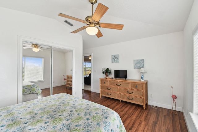 8961 A1A, Saint Augustine, FL 32080 - bedroom featuring vaulted ceiling, multiple windows, wood finished floors, a ceiling fan, and a closet