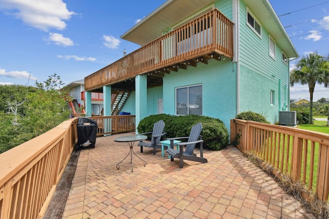 8961 A1A, Saint Augustine, FL 32080 - view of patio with stairway, a grill, and a wooden deck