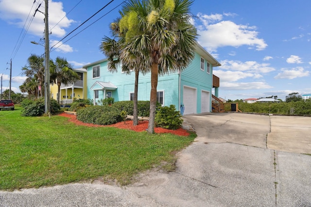 8961 A1A, Saint Augustine, FL 32080 - view of front facade with driveway, a garage, and a front yard