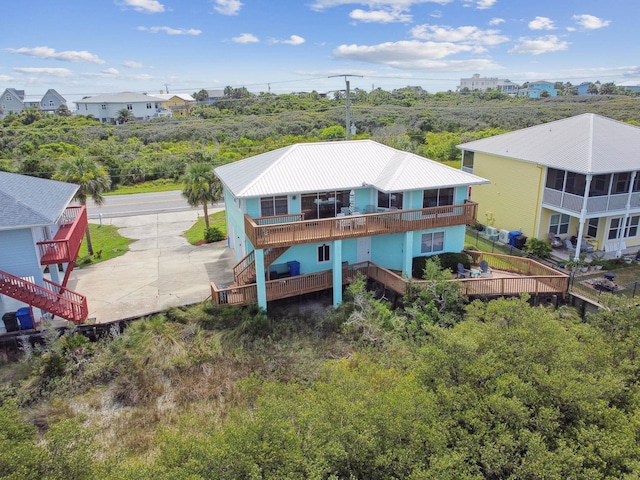 8961 A1A, Saint Augustine, FL 32080 - rear view of property with stairs and a metal roof