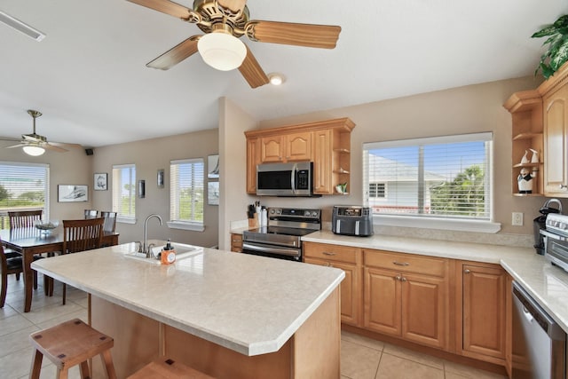 8961 A1A, Saint Augustine, FL 32080 - kitchen with stainless steel appliances, open shelves, ceiling fan, light tile patterned floors, and light countertops