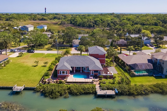 drone / aerial view featuring a water view and a residential view