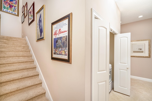 stairway with baseboards and recessed lighting