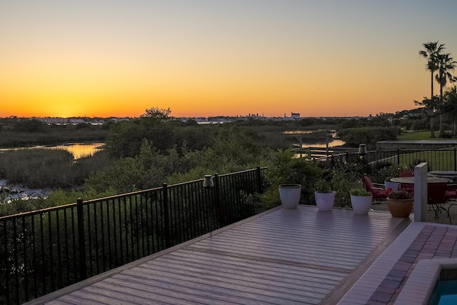wooden deck featuring a water view