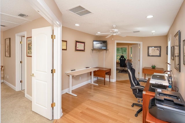 office space featuring recessed lighting, ceiling fan, visible vents, and baseboards