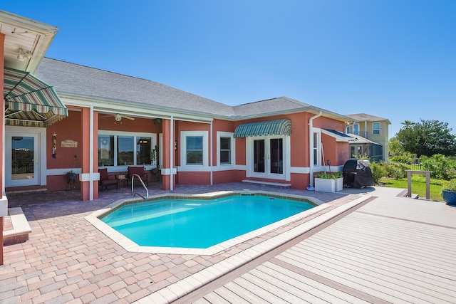 pool featuring a patio area and french doors