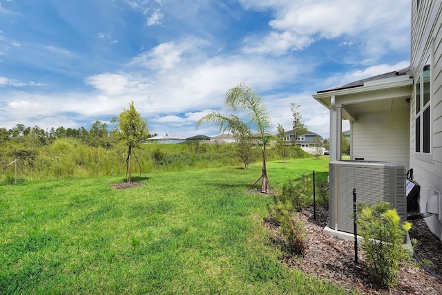 view of yard featuring central AC