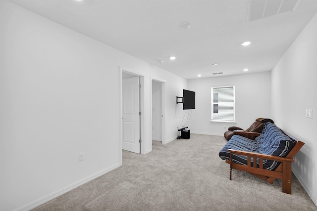 living area with light colored carpet