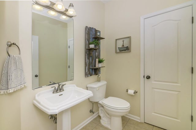 bathroom with tile patterned floors and toilet