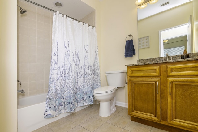 full bathroom featuring tile patterned floors, toilet, shower / bath combo with shower curtain, and vanity