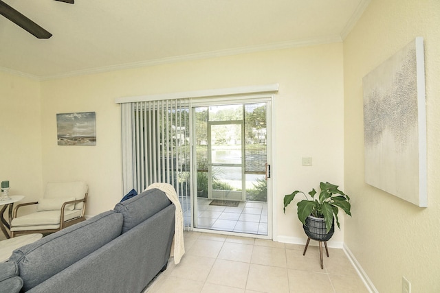 doorway to outside with crown molding, light tile patterned flooring, and ceiling fan