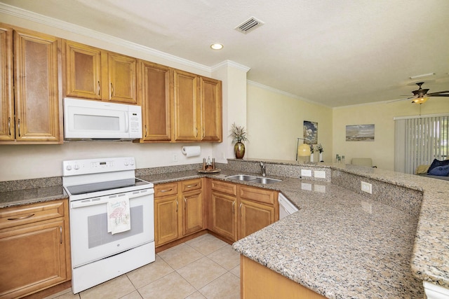 kitchen with light tile patterned flooring, sink, light stone counters, crown molding, and white appliances