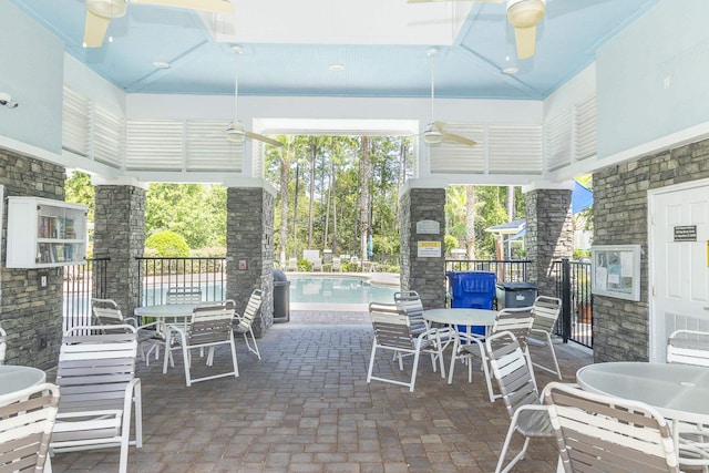 view of patio / terrace featuring a community pool and ceiling fan