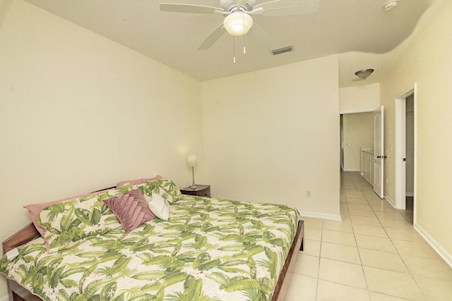 tiled bedroom with ceiling fan