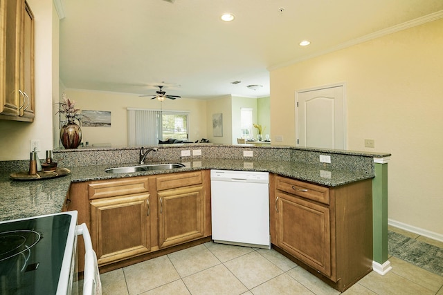 kitchen with sink, crown molding, dishwasher, dark stone countertops, and range with electric cooktop