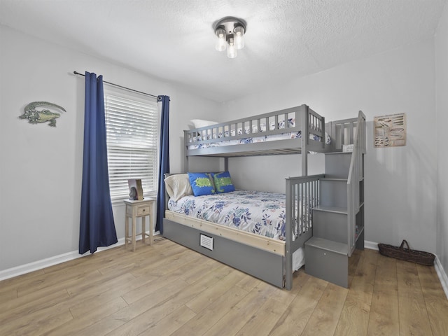 241 Tropic Way, Saint Augustine, FL 32080 - bedroom with wood finished floors and a textured ceiling