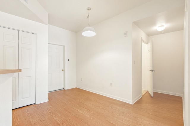 empty room with light hardwood / wood-style floors