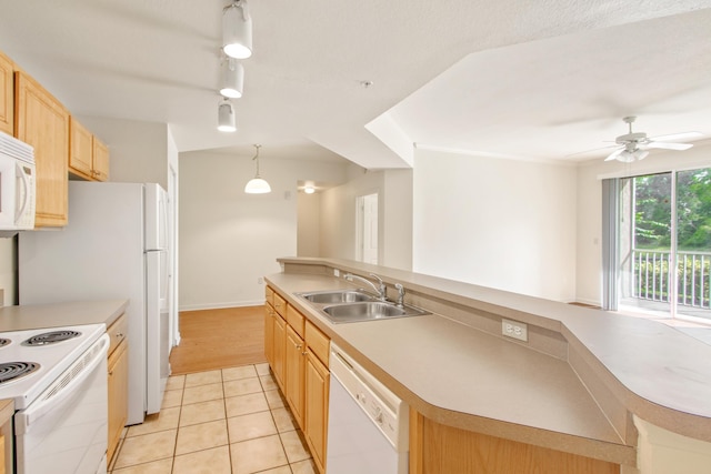 kitchen with decorative light fixtures, sink, white appliances, light tile patterned flooring, and light brown cabinetry