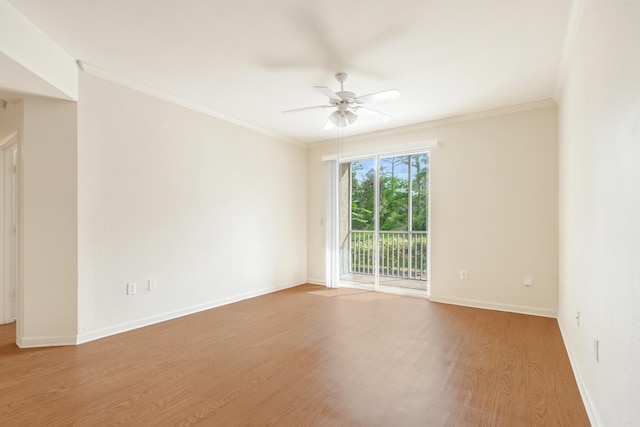 empty room with ceiling fan, wood-type flooring, and crown molding