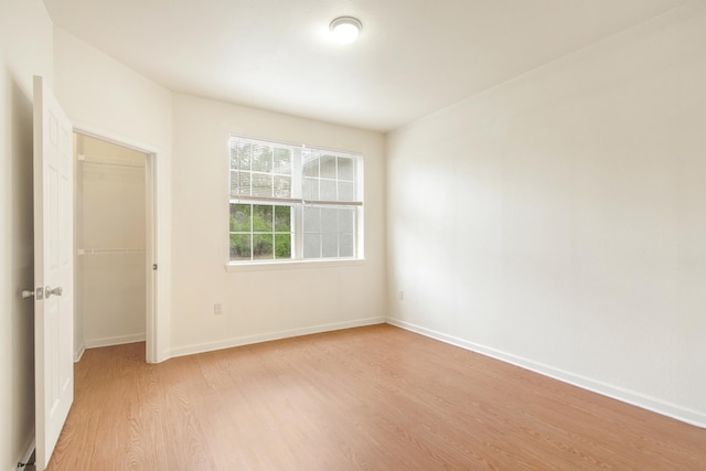 unfurnished room with light hardwood / wood-style flooring