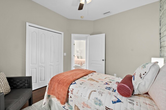 bedroom with a closet, ceiling fan, and hardwood / wood-style flooring