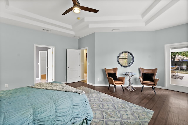 bedroom with access to outside, a raised ceiling, ceiling fan, and dark hardwood / wood-style flooring