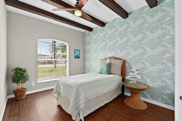 bedroom with beam ceiling, ceiling fan, and hardwood / wood-style floors