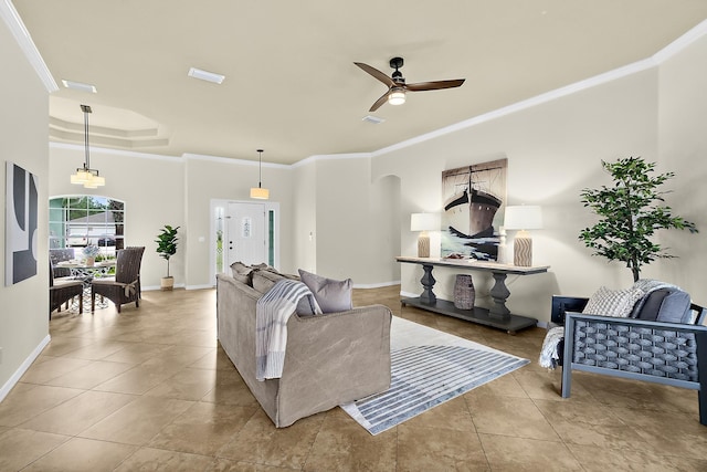 tiled living room featuring ceiling fan and crown molding