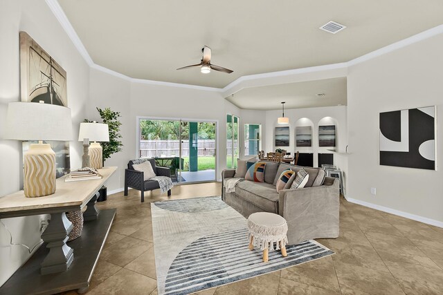 tiled living room featuring ceiling fan and crown molding