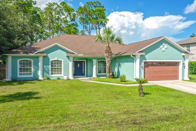 single story home featuring a garage and a front lawn