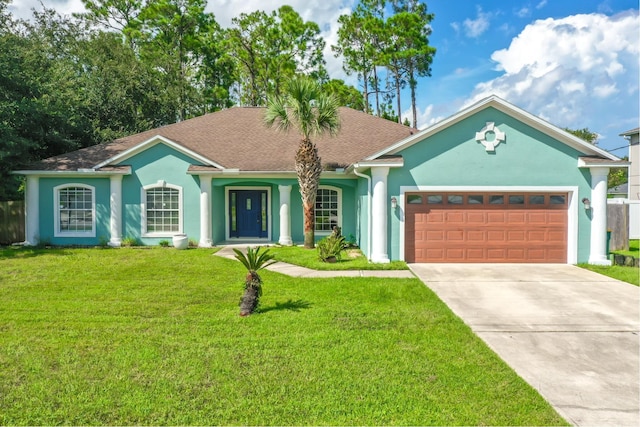 single story home with a garage and a front lawn