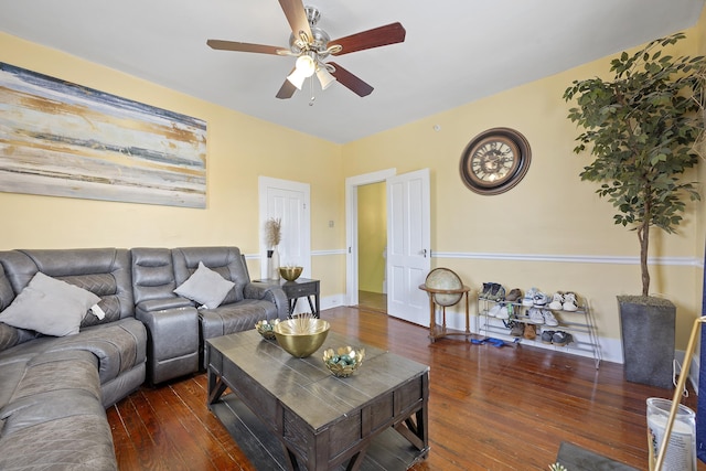 living room with dark hardwood / wood-style floors and ceiling fan