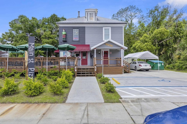 view of front of property with a carport